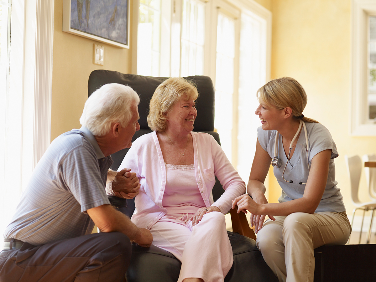 Hospice Nurse Talking to Couple
